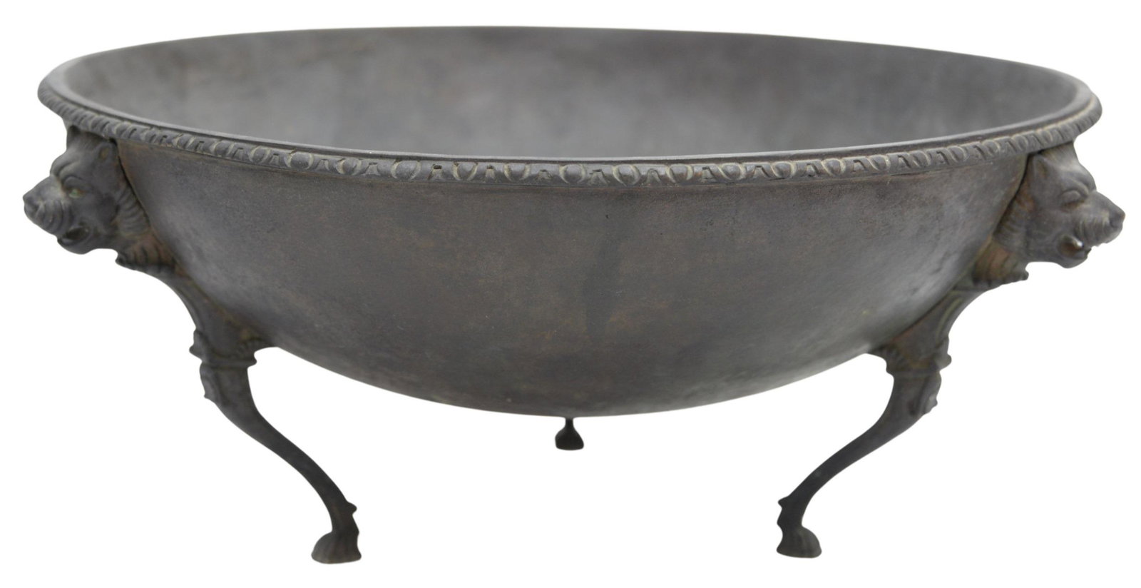 Early Bronze Ceremonial Feast Bowl: Early Bronze Ceremonial Feast Bowl, sitting on three legs, each topped with lion and masks, possibly 18th century or earlier, height 6 3/4 inches, diameter 15 1/4 inches.