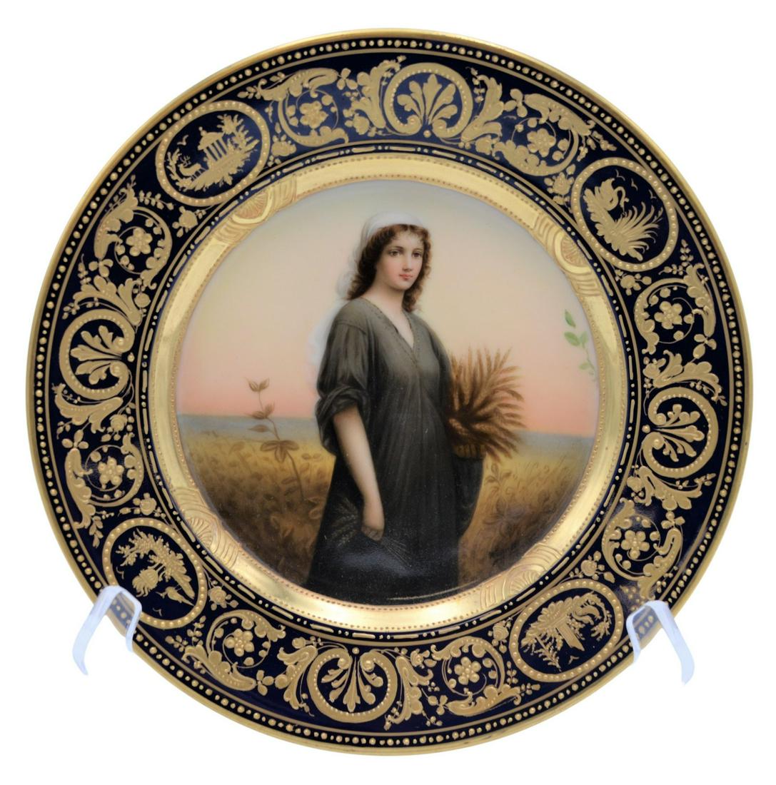 Royal Vienna Wagner Portrait Plate: Royal Vienna Wagner Portrait Plate, "Ruth", having high relief border, stamped "Carlsbad" and stamped with Royal Vienna beehive on reverse featuring the biblical figure Ruth collecting wheat in a fiel