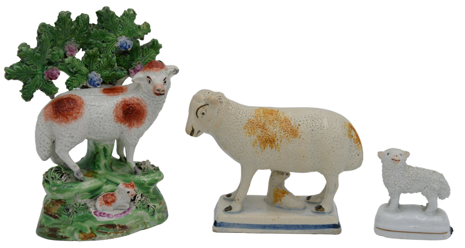 Three Piece Staffordshire 19th Century Pearlware: Three Piece Staffordshire 19th Century Pearlware, sheep grouping to include one sheep and lamb (some chipping), height 4 inches; one small lamb, height 2 inches; along with one group figure of a red a