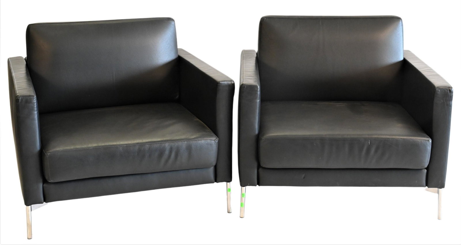 Pair of Leather Upholstered Knoll Club Chairs: Pair of Leather Upholstered Knoll Club Chairs, each set on chrome legs and bare "Knoll" upholstery to underside of chairs, height 31 inches, width 36 inches, depth 34 1/2 inches.