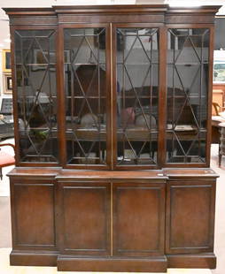 Schmieg & Kotzian Two Part Mahogany Breakfront Top: Schmieg & Kotzian Two Part Mahogany Breakfront Top, having Egyption key motif over four glass doors opening to shelving over center door with brass accents, height 82 inches, width 65 inches, Depth 21