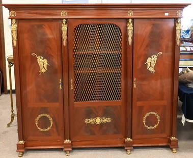 French Empire Revival Triple Armoire: French Empire Revival Triple Armoire, with gilt Pharaonic herms above feet, height 68 inches, length 76 inches, depth 21 inches.