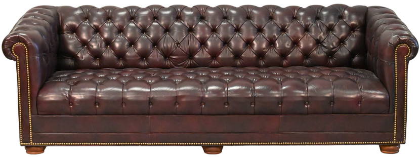 Leather Upholstered Chesterfield Sofa: Leather Upholstered Chesterfield Sofa, having tufted back & seat & arms, set on bun feet, height 28 inches, length 84 inches.