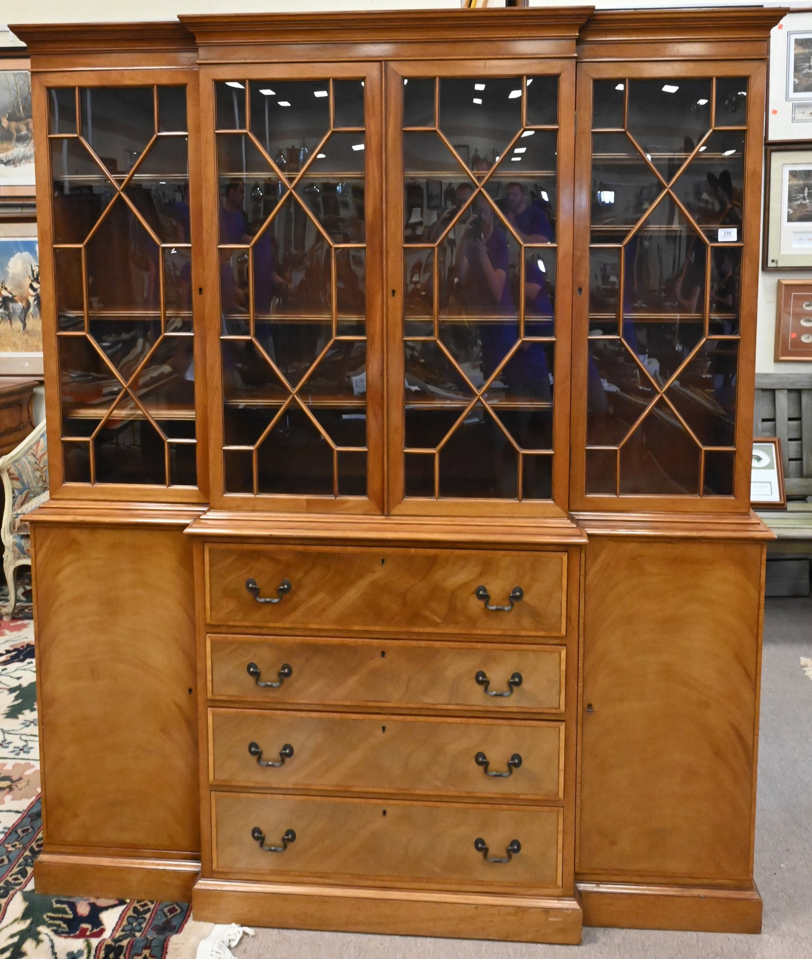 Mahogany Breakfront: Mahogany Breakfront, in two parts with a pull out desk compartment, has shelves, sun faded, height 79 inches, width 66 inches.