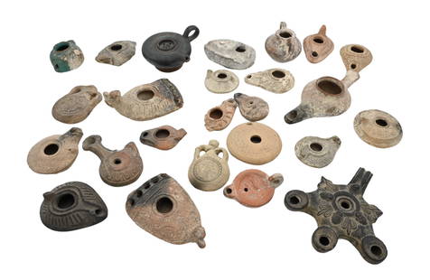 25 Ancient Pottery Objects: 25 Ancient Pottery Objects Circa 4th century B.C. - 5th century A.D. or later To include 22 Roman and Byzantine lamps2 St. Menas pilgrim flasks Along with a Greek black glazed guttus Largest width 6