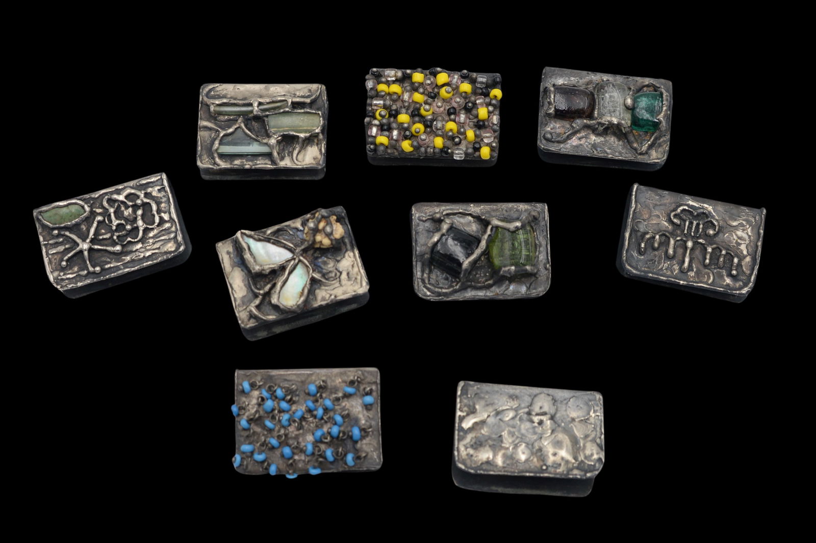 Nine Silver Matchbox Holders: Nine Silver Matchbox Holders, probably Israeli, some mounted with stones, 12 t.oz. total weight, 2 1/4 inches length, 1 1/2 inches height