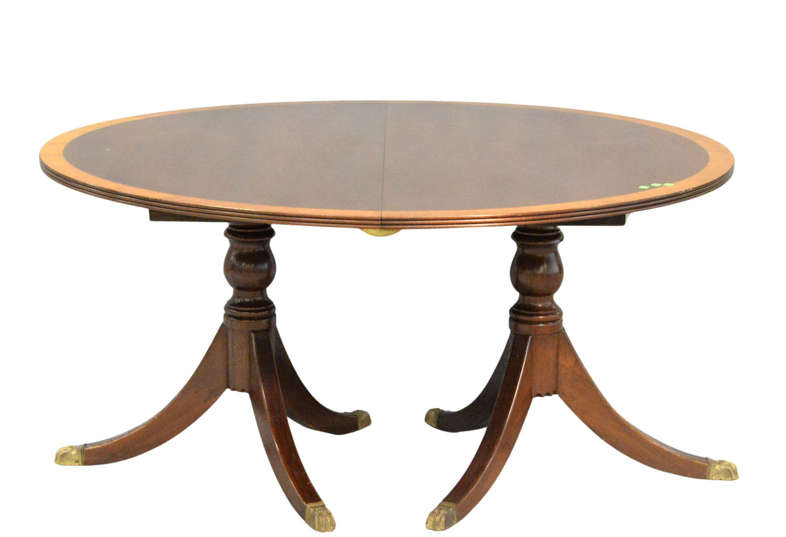 Round Mahogany Inlaid Dining Table: Round Mahogany Inlaid Dining Table, Regency style, 60 inches diameter, opens to 108 inches, two 24 inches leaves two pedestal satinwood banding