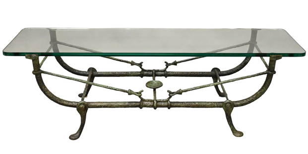 After Diego Giacometti (French/Swiss 1902 - 1985): After Diego Giacometti (French/Swiss 1902 - 1985) Bronze Cocktail Table, circa 1965 having cradle form base with glass top height 15 inches, length 46 3/4 inches, depth 19 inches Condition: very good