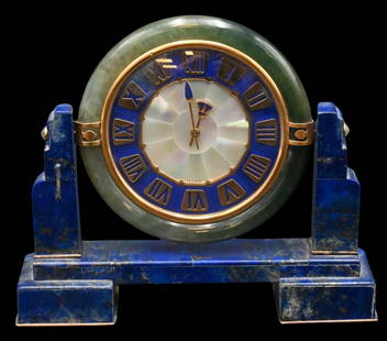 Cartier Rare Art Deco Desk Clock: Cartier Rare Art Deco Desk Clock having circular nephrite frame, Lapis face having enameled gold hands, 18k gold and jewel supports mounted to Lapis frame on silver feet, back of clock marked Cartier