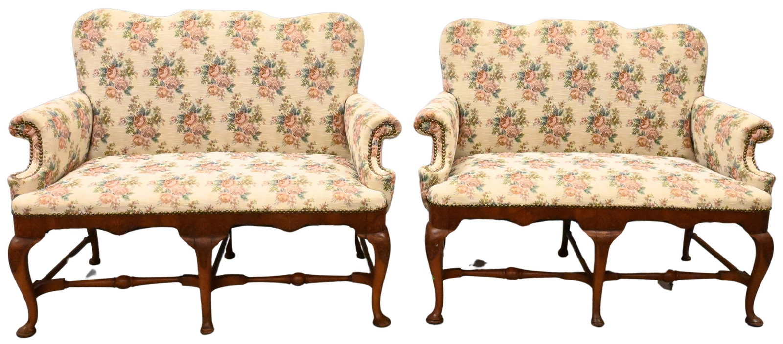 Pair of Queen Anne Style Settees: Pair of Queen Anne Style Settees having shaped backs and floral upholstery over stretcher base and pad feet height 37 1/2 inches, length 48 inches