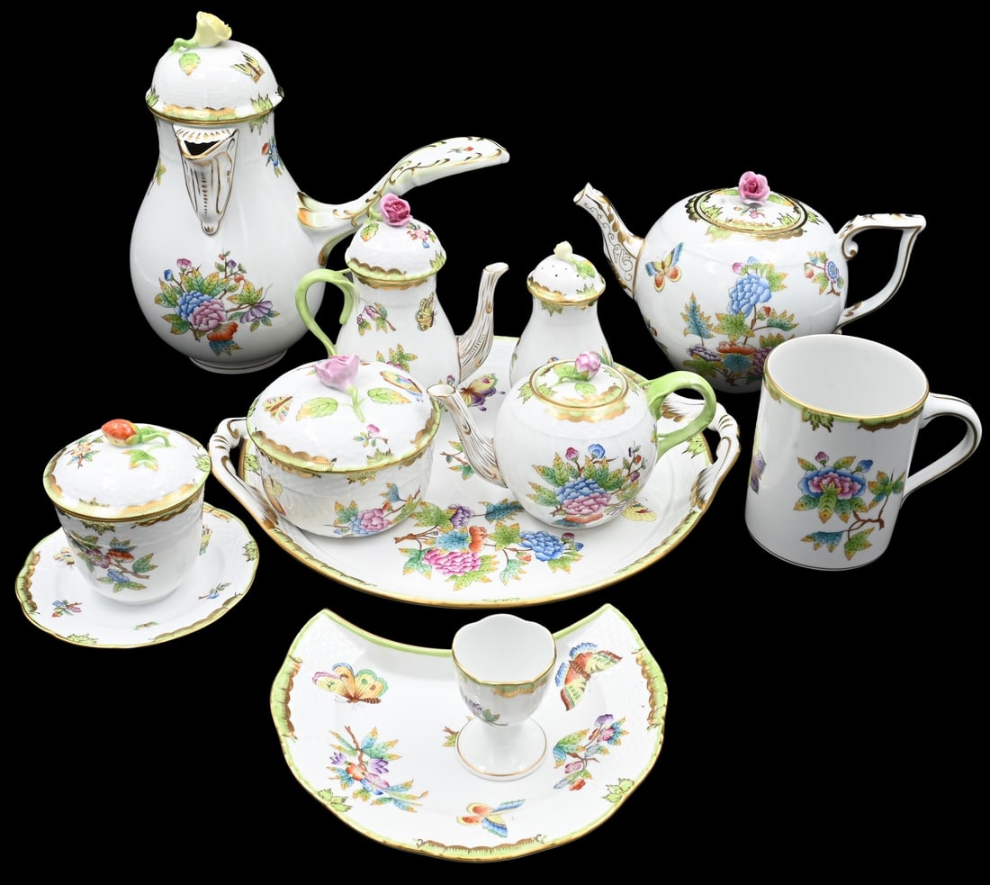 42 Piece Group of Herend "Queen Victoria" Porcelain: 42 Piece Group of Herend "Queen Victoria" Porcelain to include 12 crescent salad plates, tea set with creamer, sugar tray, ladles, cups, egg cups, chocolate pot, etcetera Provenance: Property of a New