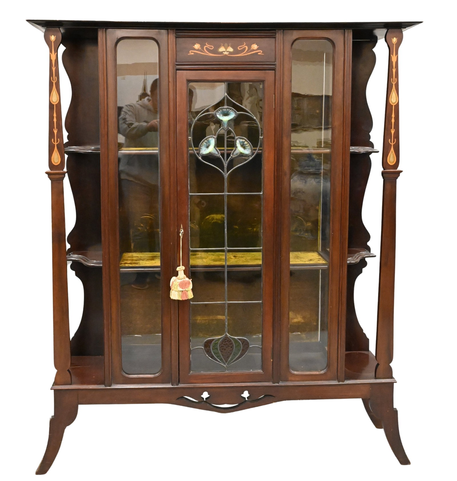 Art Nouveau Mahogany Curio Cabinet: Art Nouveau Mahogany Curio Cabinet having wood and metal inlays as well as three dimensional leaded flowers in door height 69 inches, width 58 inches Provenance: From Collection of Steven and Paula Sc