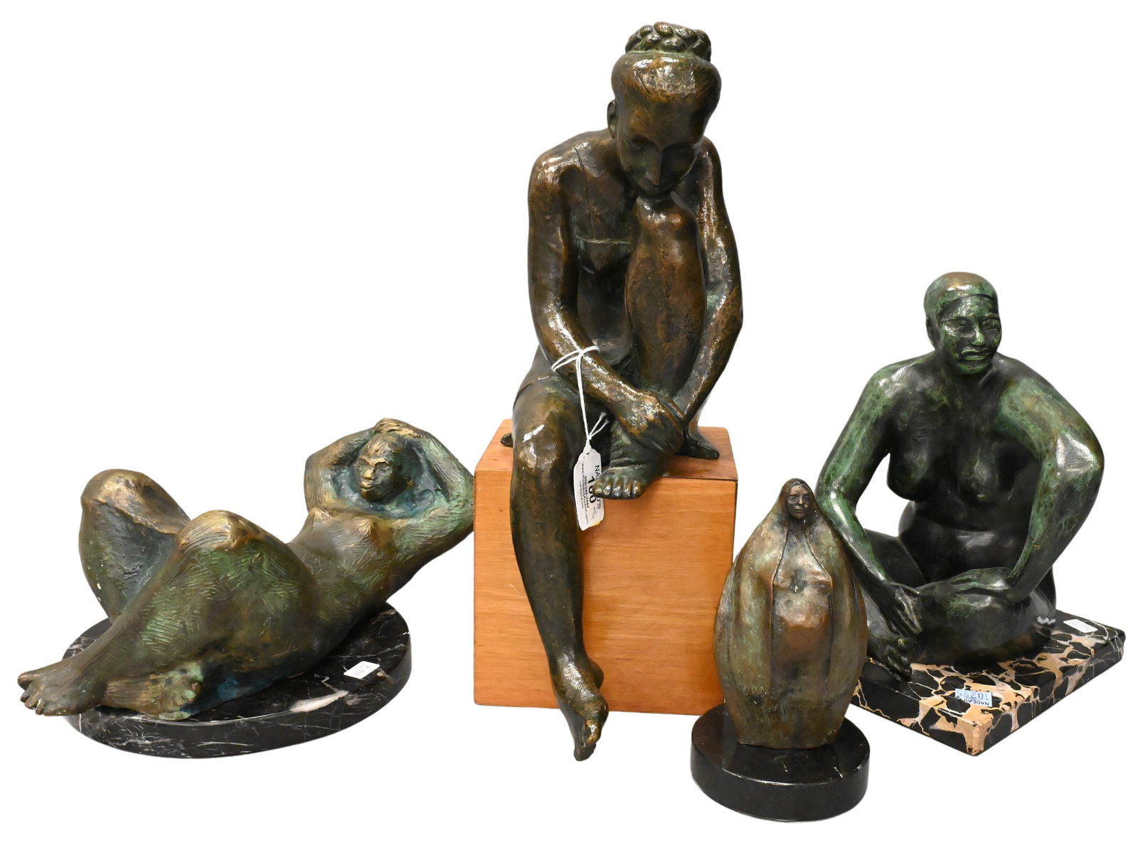 Four Bronze Figures: Four Bronze Figures to include Bronze on wood base of figure with chin on knee Signed near base illegibly, labeled S. Reyez C Height of bronze 19 inches Bronze reclining figure Initialed and dated DA