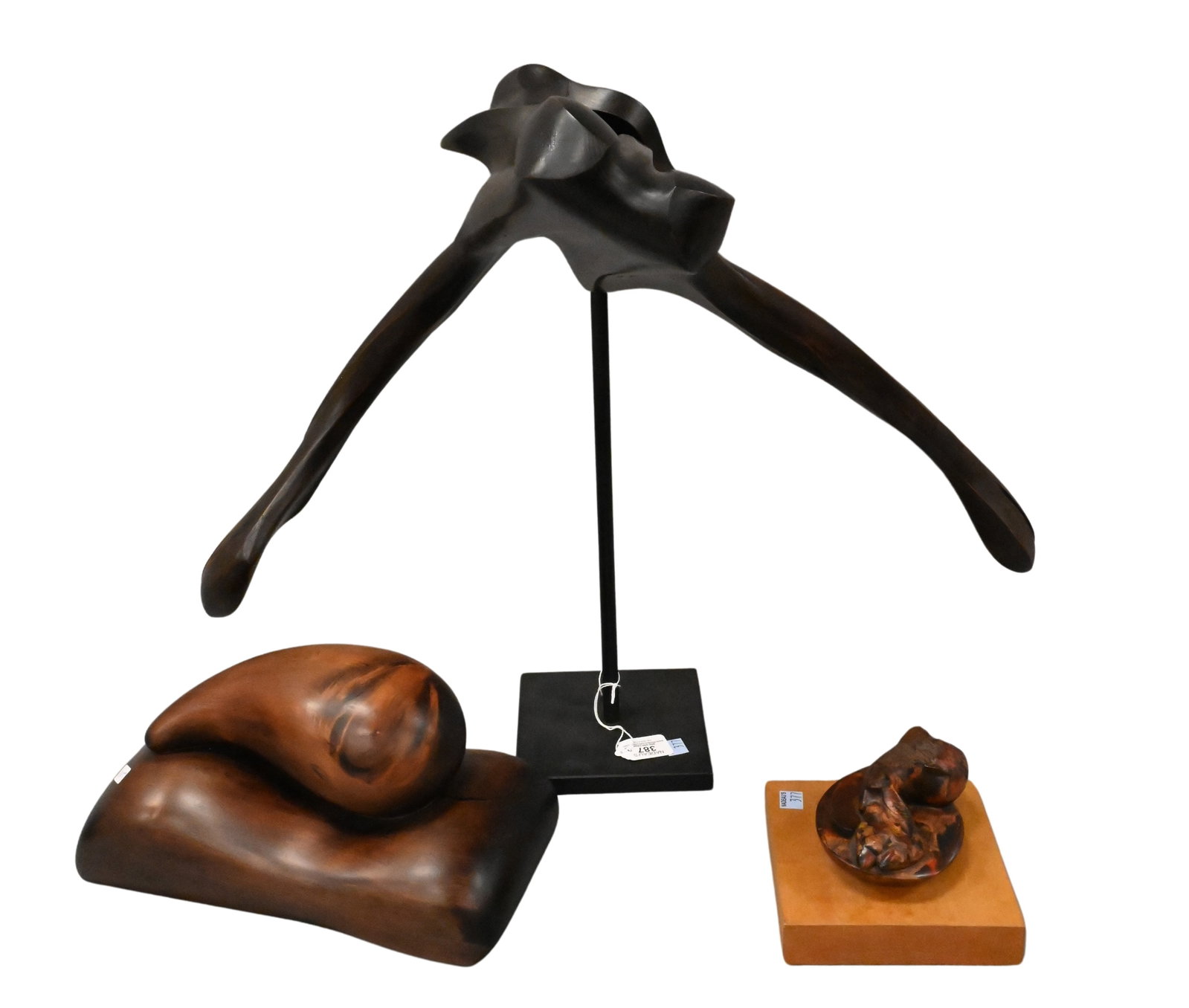 Three: Philip McCracken (American 1928-2021): Three: Philip McCracken (American 1928-2021) "Tear", 1984 Carved wood Signed and dated on underside "Philip McCracken 1984" height 6 1/2 inches length 13 inches "Dark Presence", 1983 Juniper wood scul