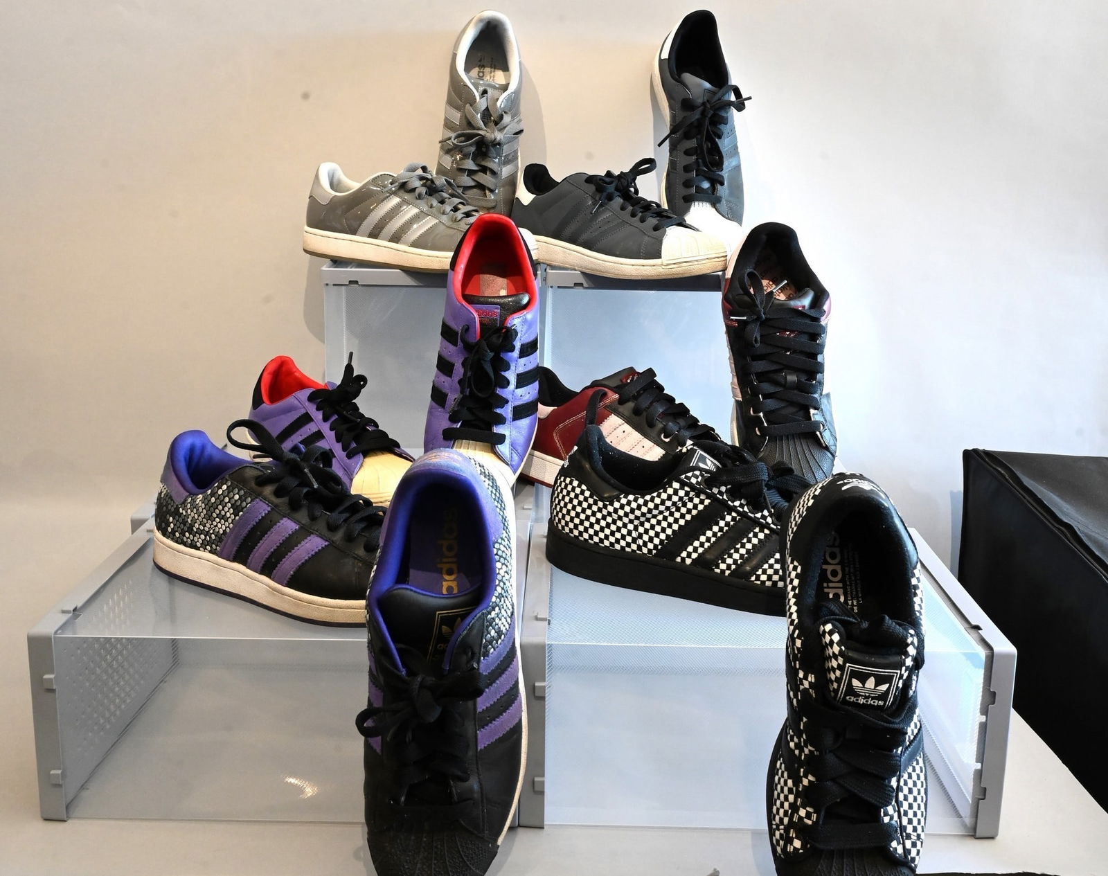 Six Pairs of Men's Adidas Sneakers: Six Pairs of Men's Adidas Sneakers Adidas Sneakers Superstar Black and White Almost new with no marks or scuffs Size 8.5 Adidas Sneakers Superstars in Black and Purple Used with marks and scuffs on sh