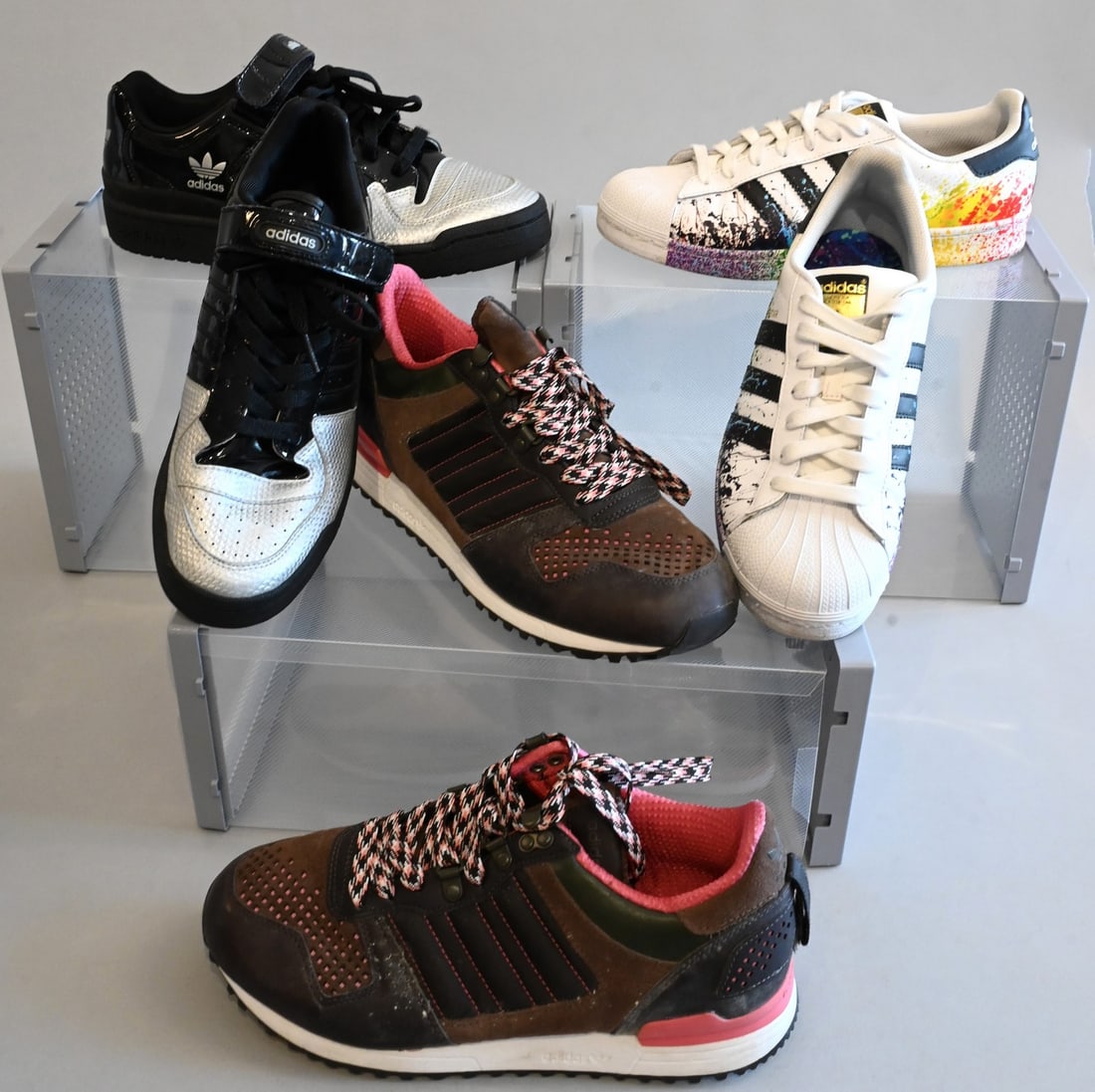 Three Pairs of Men's Adidas Sneakers: Three Pairs of Men's Adidas Sneakers Adidas Sneakers, ZX 700 O Store in Brown and Pink Slightly used with dirt marks and few scuffs, Retails for $200 Size 9 Adidas Sneakers Superstar Pride Collection