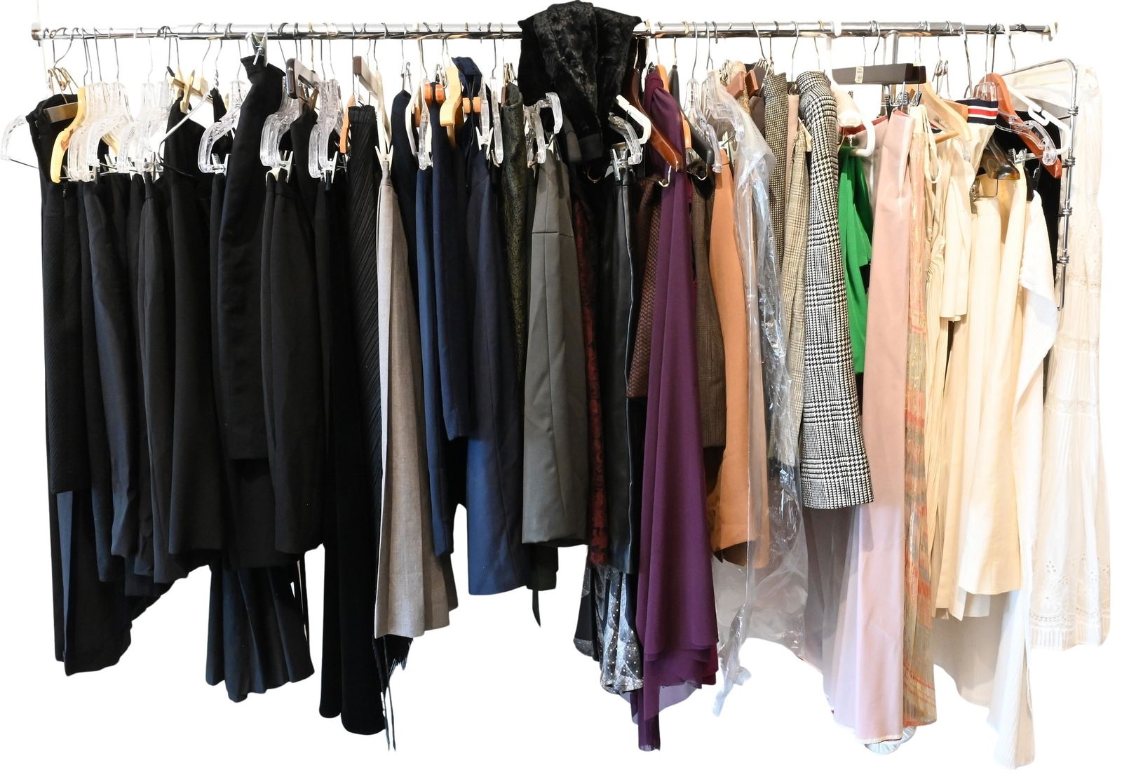 Full Rack of Women's Skirts: Full Rack of Women's Skirts to include tweed and wool suit skirts, linen, patterned, silk, leather, etcetera sizes small through medium Condition: normal wear