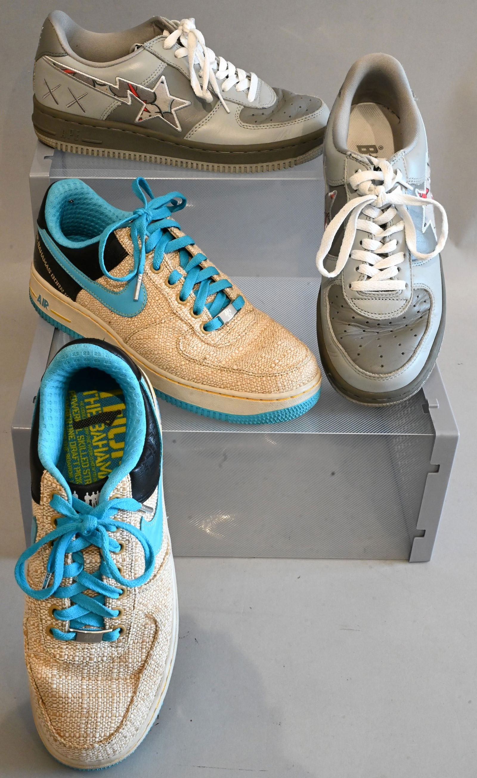 Two Pairs of Men's Sneakers: Two Pairs of Men's Sneakers A Bathing Ape Sneakers Kaws x Bapesta FS-001 Low in Grey and White Almost new with few scuffs and marks, Retails for $400 Size 8.5 Nike Sneakers Air Force 1 Low PRM Thompso