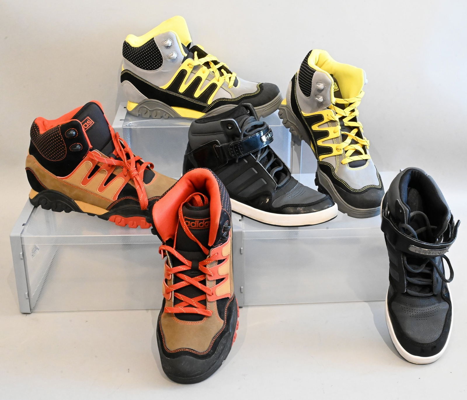 Three Pairs of Men's Adidas Shoes: Three Pairs of Men's Adidas Shoes Adidas Men's Sneakers AR 2.0 in Black Worn with few scuffs marks on bottom Size 8.5 Adidas Men's Hiking Shoes in Black and Orange Almost new with very little marks Si
