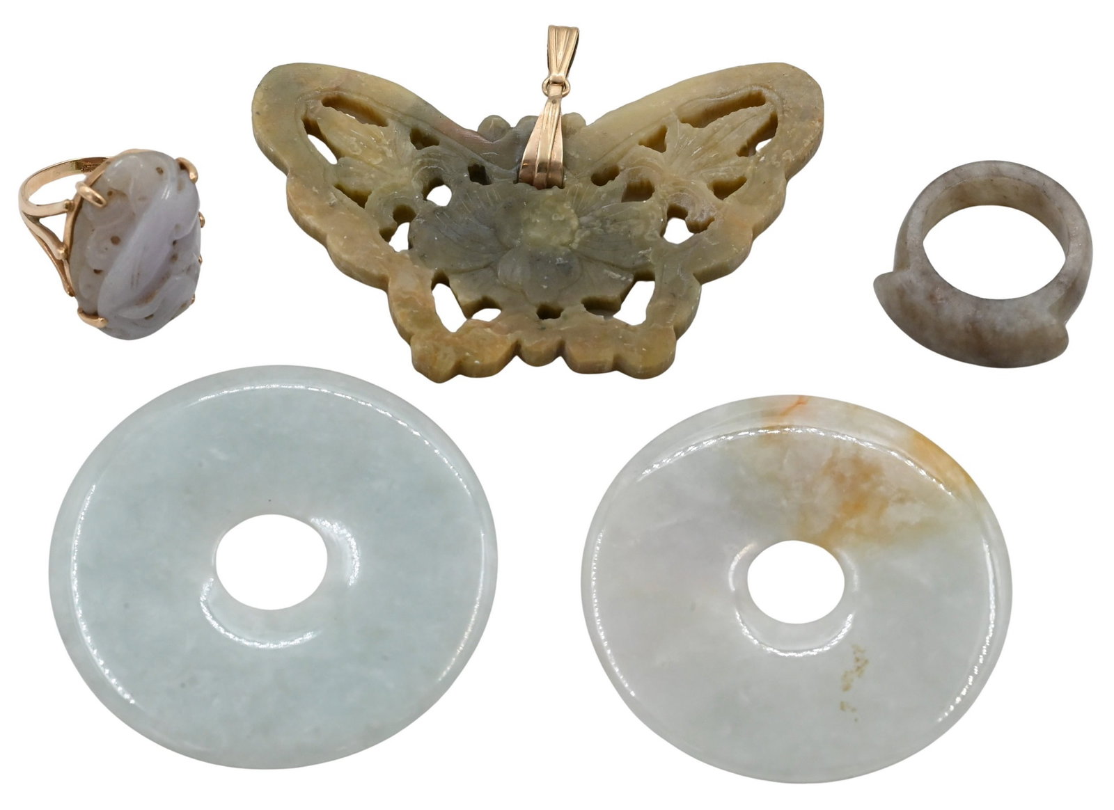 Group of Hard Stone Carvings: Group of Hard Stone Carvings to include two disks, one carved and marked gold ring, one carved butterfly with 14 Karat gold clasp and one carved ring length 3 inches