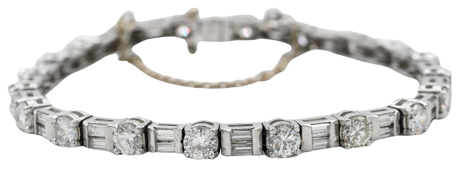 Platinum and Diamond Bracelet: Platinum and Diamond Bracelet with alternating double baguette and round diamonds. 20 round diamonds and 38 baguette diamonds 6 1/4", 19.8 grams