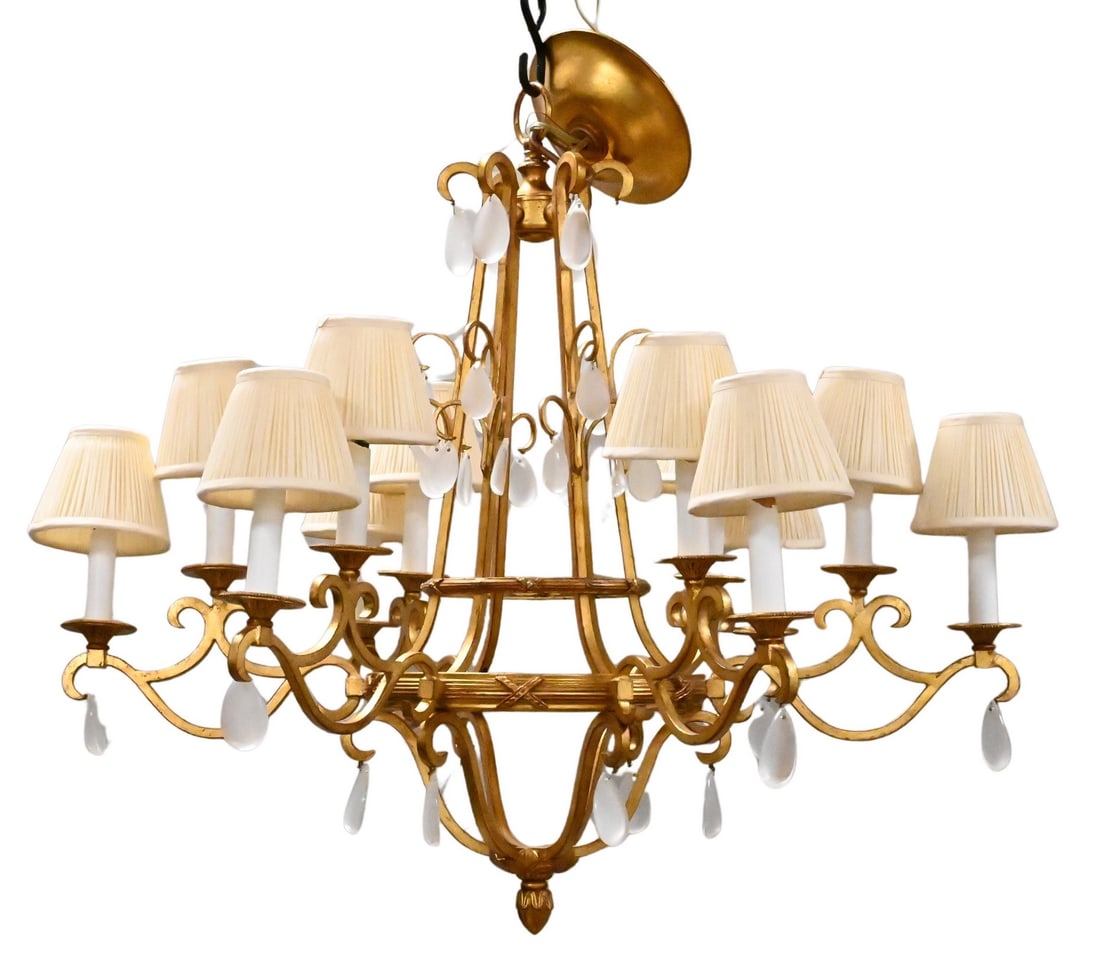 Gilt Bronze Twelve Light Chandelier: Gilt Bronze Twelve Light Chandelier having six arms with two lights on each, milk glass teardrop accents, custom shades, height approximately 32 inches Provenance: D & D Antiques 226 E 59th St, New Yo