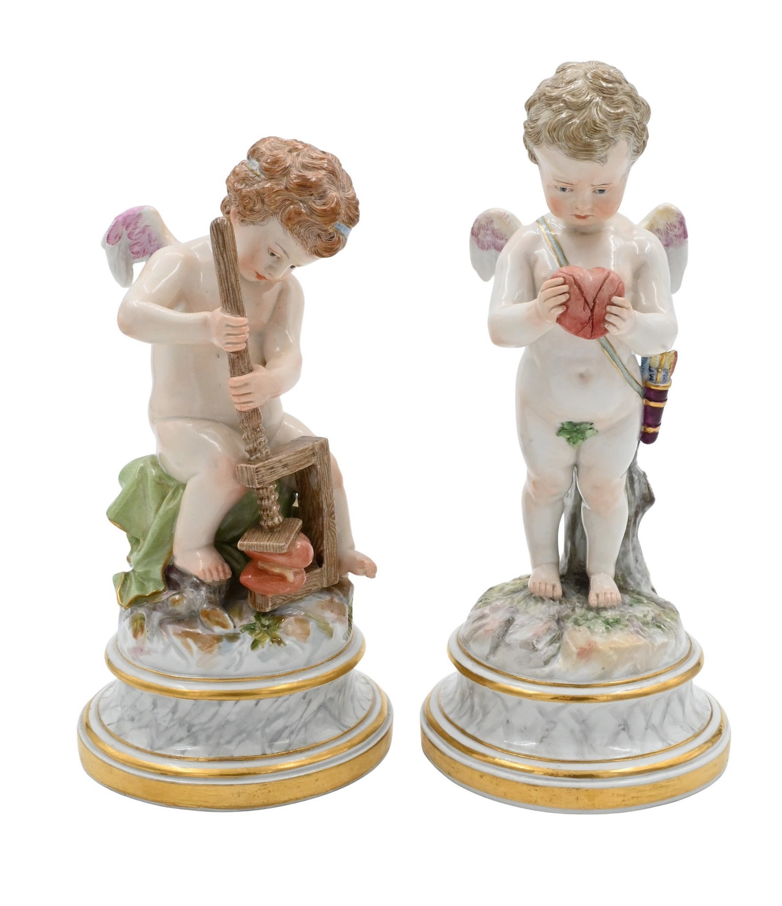 Two Meissen Porcelain Putti Figures: Two Meissen Porcelain Putti Figures one holding a heart, the other squashing two hearts in a press impressed, impressed 107 and L116 putti holding heart height 8 inches, the other height 7 1/4 inches 