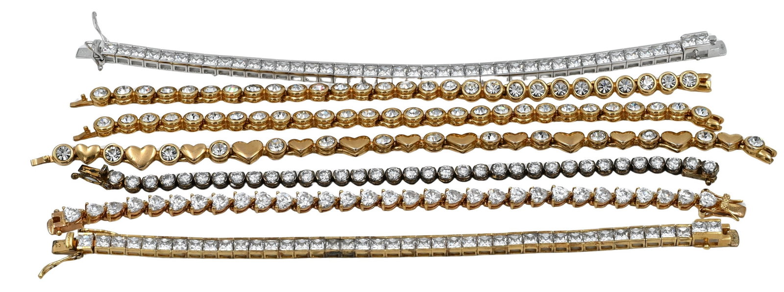 Group of Seven Line or Tennis Bracelets: Group of Seven Line or Tennis Bracelets gold plated, cubic zirconias longest 7 1/2 inches