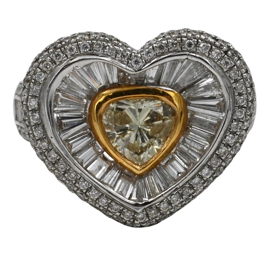 18K White Gold and Diamond Ring: 18K White Gold and Diamond Ring having center heart cut ediamond 5.8mm x 5.2mm, set with yellow gold bezel surrounded by bagette cut diamonds radiating out with pave set melee diamond halo, shank set 