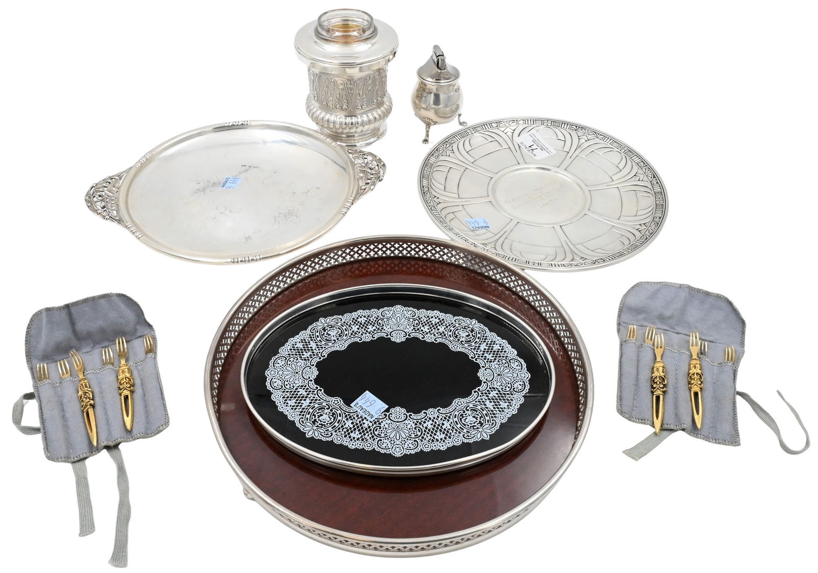 Group of Silver: Group of Silver to include sterling silver trays, one weighted sterling lighter, on silver rimmed glass tray, one sterling silver urn with removable cup, silver plate round tray and set of 12 small le