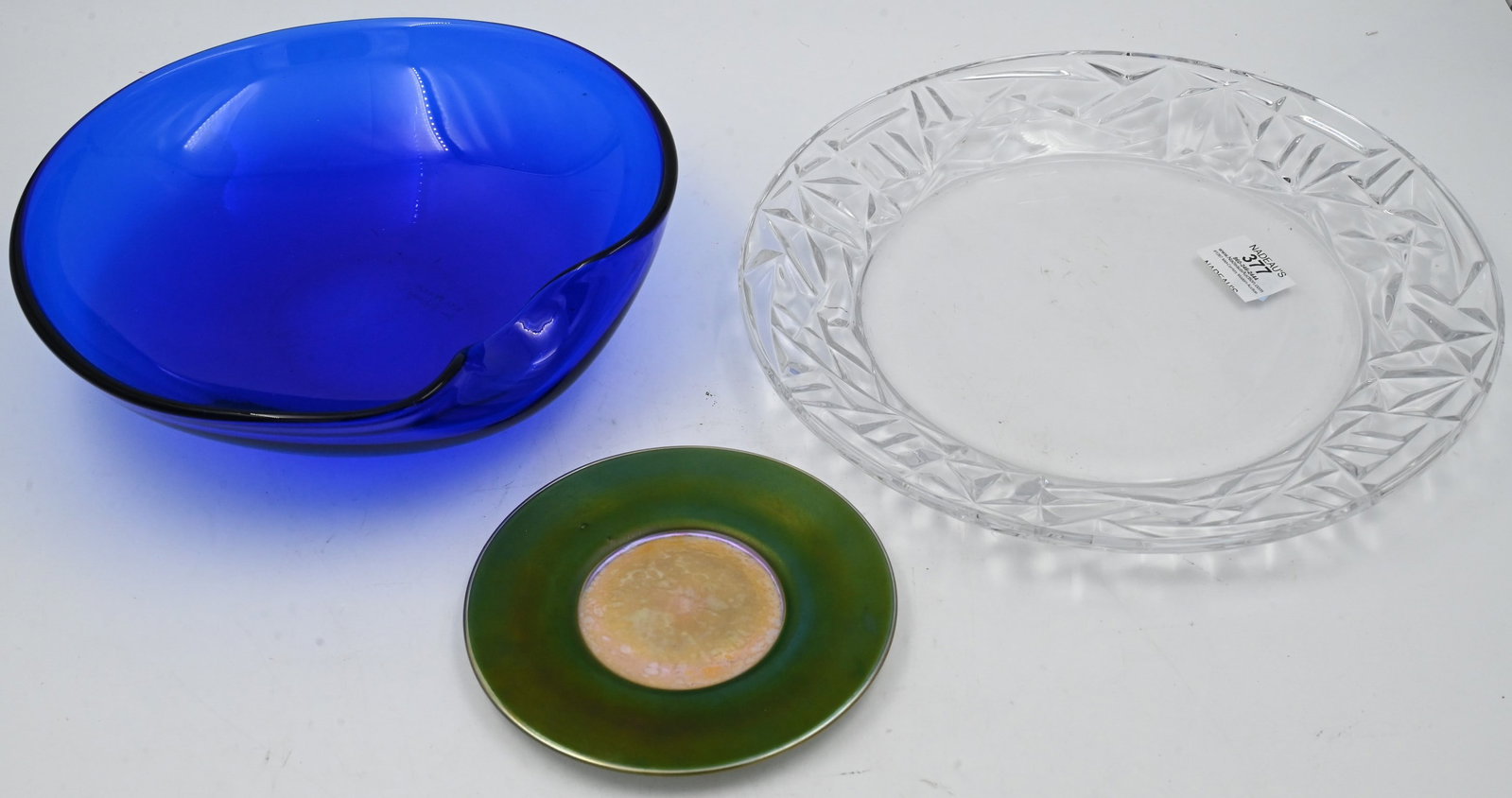 Three Piece Tiffany and Company Lot: Three Piece Tiffany and Company Lot to include Tiffany and Company crystal plate, Elsa Peretti for Tiffany cobalt blue bowl, L.C. Tiffany Favrile plate Peretti bowl diameter 10 1/4 inches Provenance: 