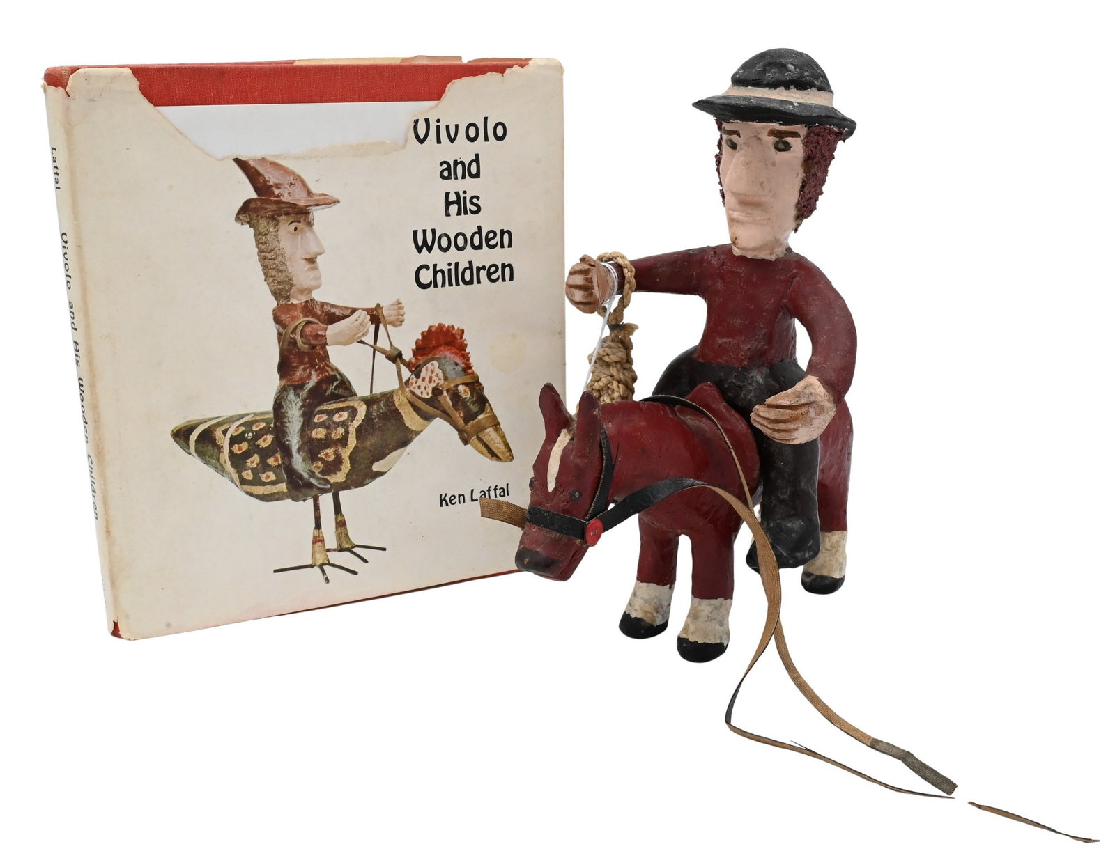 John Vivolo (American 1886-1987): John Vivolo (American 1886-1987) Polychrome Folk Art sculpture of a cowboy on a horse, along with book total height 10 inches