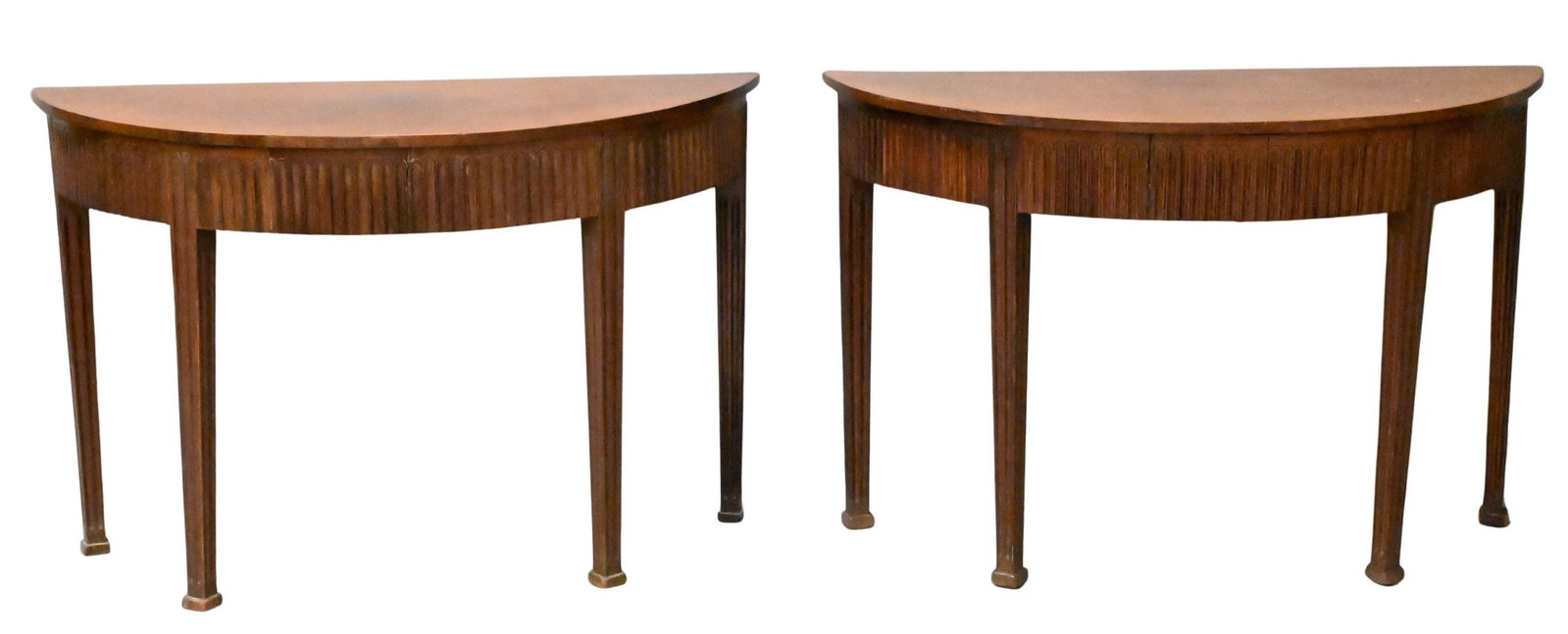 Pair of Mahogany Reeded Demilune Consoles: Pair of Mahogany Reeded Demilune Consoles each set on tapered legs height 27 1/2 inches, top 18 1/2" x 42 1/2"