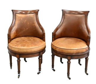 Pair of Leather Upholstered Swivel Chairs
