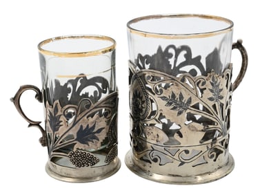 Two Sets of Silver Tea Cup Holders