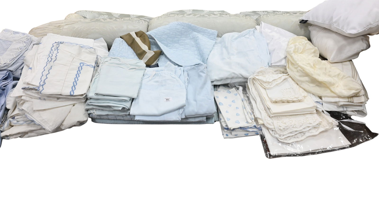 Large Table Lot of Assorted Linens: Large Table Lot of Assorted Linens to include handkerchiefs, place mats, pillow cases, table clothes, etcetera