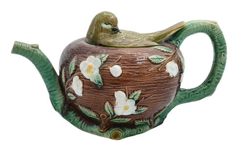 Majolica Holdcroft Bird in Nest Teapot: Majolica Holdcroft Bird in Nest Teapot the body in the form of a birds nest supported by green branches forming handle and spout surmounted by resting bird figural lid, marked on base 18 height approx