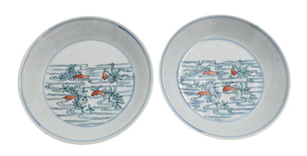Pair of Chinese Doucai Enamel Plates: Pair of Chinese Doucai Enamel Plates both having waves and leaf motif accented with orange flower forms, having flarings rims set on small round footed base having character marks and wax seals to und