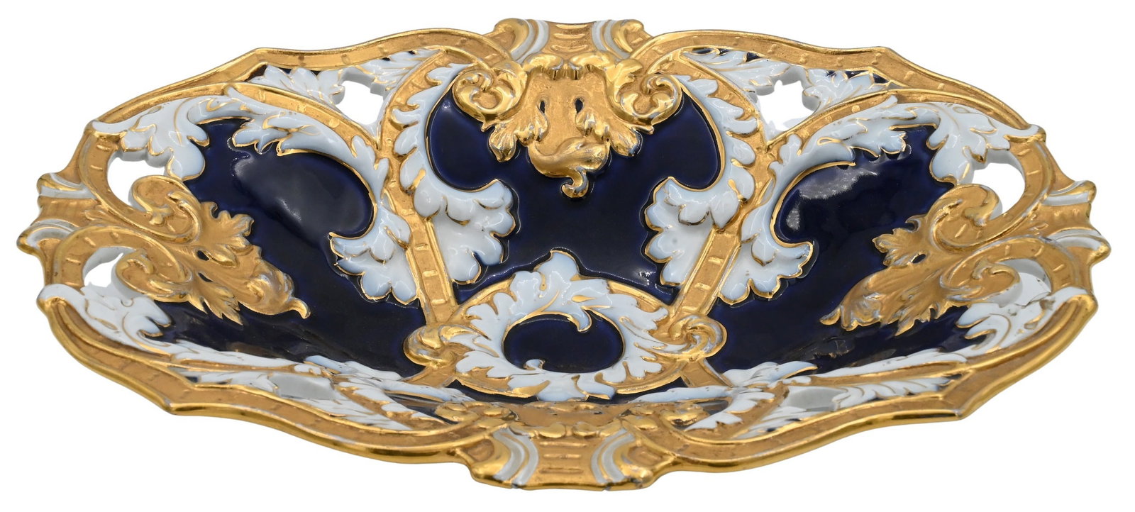 Meissen Shallow Bowl: Meissen Shallow Bowl having gilt trim and openwork height 2 1/2 inches, length 13 inches, width 10 inches Provenance: Property from the Estate of E.T. Krolikowski, III of Laurel Beach in Milford, Conn