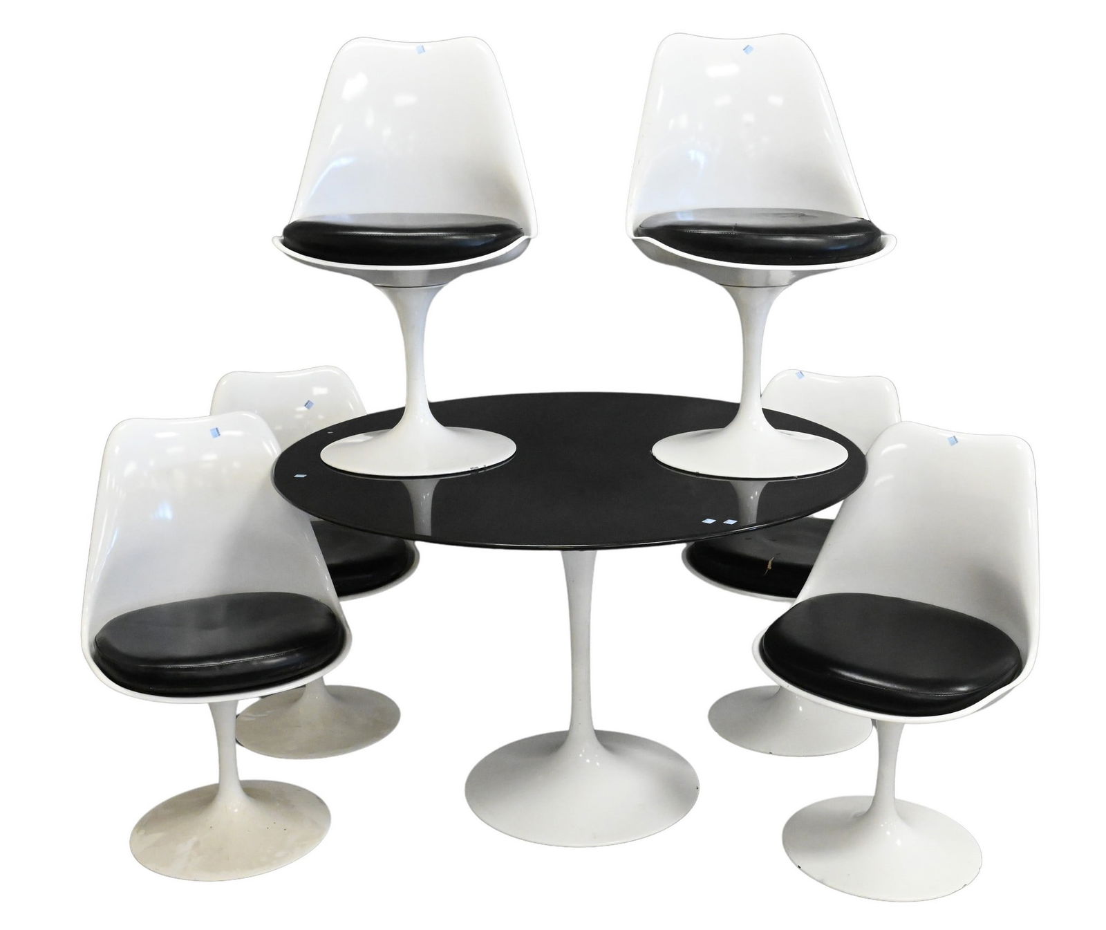 Seven Piece Eero Saarinen for Knoll Dining Set: Seven Piece Eero Saarinen for Knoll Dining Set to include white tulip side chairs in black upholstery, along with black marble top round dining table table height 28 inches, diameter 46 inches