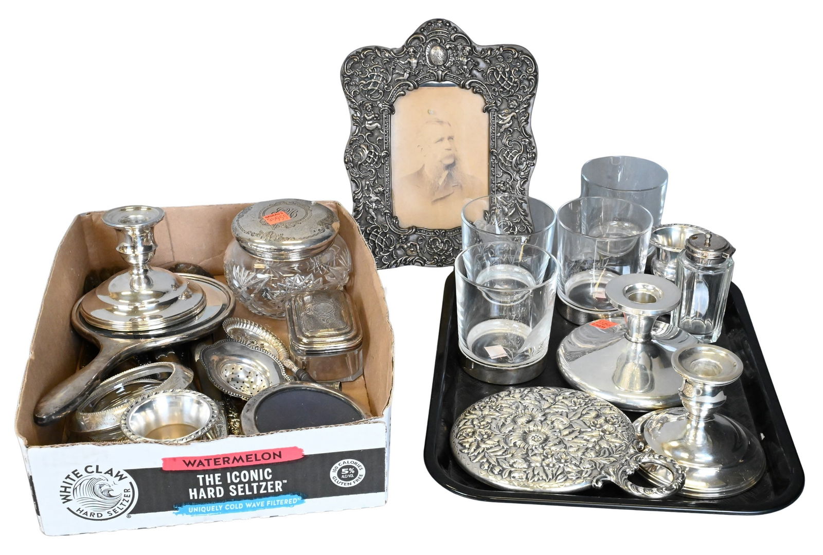 Group of Weighted Sterling Silver: Group of Weighted Sterling Silver to include picture frames, mirrors, four etched glass cups, candlesticks, etcetera longest 9 1/2 inches Provenance: Property from The Estate of Sally G. Chubb of Bern