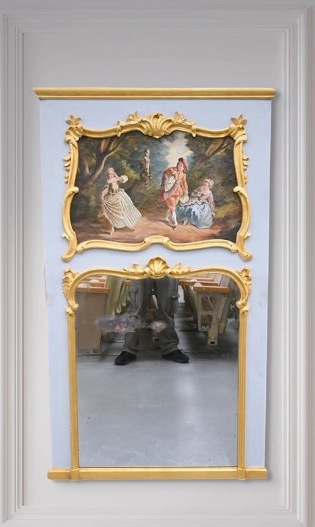 French Louis XV Court Scene Trumeau Mirror: French Louis XV Court Scene Trumeau Mirror top having oil on canvas depicting a young man and two court ladies in a garden landscape over bottom mirror having rounded top and bordered with carved gilt