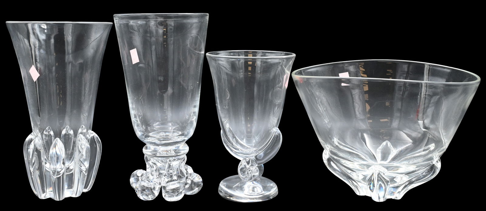 Four Piece Steuben Crystal Lot: Four Piece Steuben Crystal Lot to include scroll snail footed base #7913, tall scroll footed vase #7968, lotus vase along with large floret bowl, all signed on base tallest 10 1/4 inches