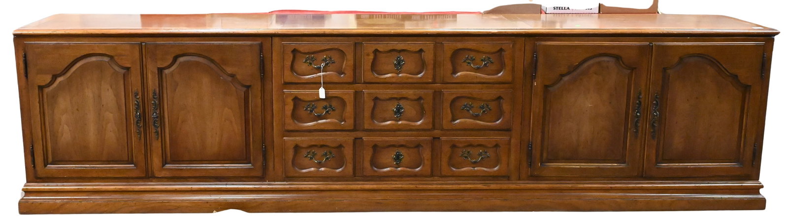 Milling Road Walnut Sideboard: Milling Road Walnut Sideboard having three center drawers flanked by two double doors height 31 inches, top 19" x 121"