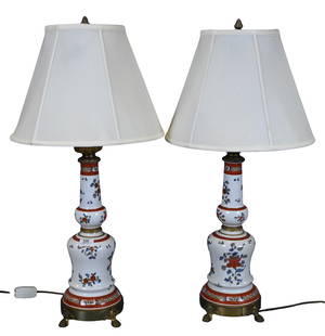 Pair of French Export Style Porcelain Table Lamps: Pair of French Export Style Porcelain Table Lamps iron red and gilt porcelain body having ornate mounts, raised on claw paw feet height 32 inches
