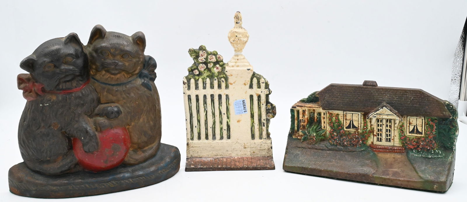 Three Antique Cast Iron Painted Doorstops: Three Antique Cast Iron Painted Doorstops to include two kittens and wool, CJO Cottage Doorstop #1283, Sarah Symonds Cast iron Garden Gate Door Stop Symonds height 8 1/4 inches, length 4 1/2 inches