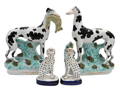 Four Staffordshire Dog Figures: Four Staffordshire Dog Figures to include pair of large Staffordshire hunting greyhounds, black and white dogs one of which is holding a rabbit in its mouth and the other with a rabbit at its feet bot