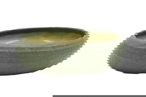 Grueby Pottery Shallow Bowl: Grueby Pottery Shallow Bowl matte green glaze, interior having swirl decoration impressed, marked on bottom diameter 10 inches Provenance: Estate of Michael and Elizabeth Ponak Pomfret Center, Connect
