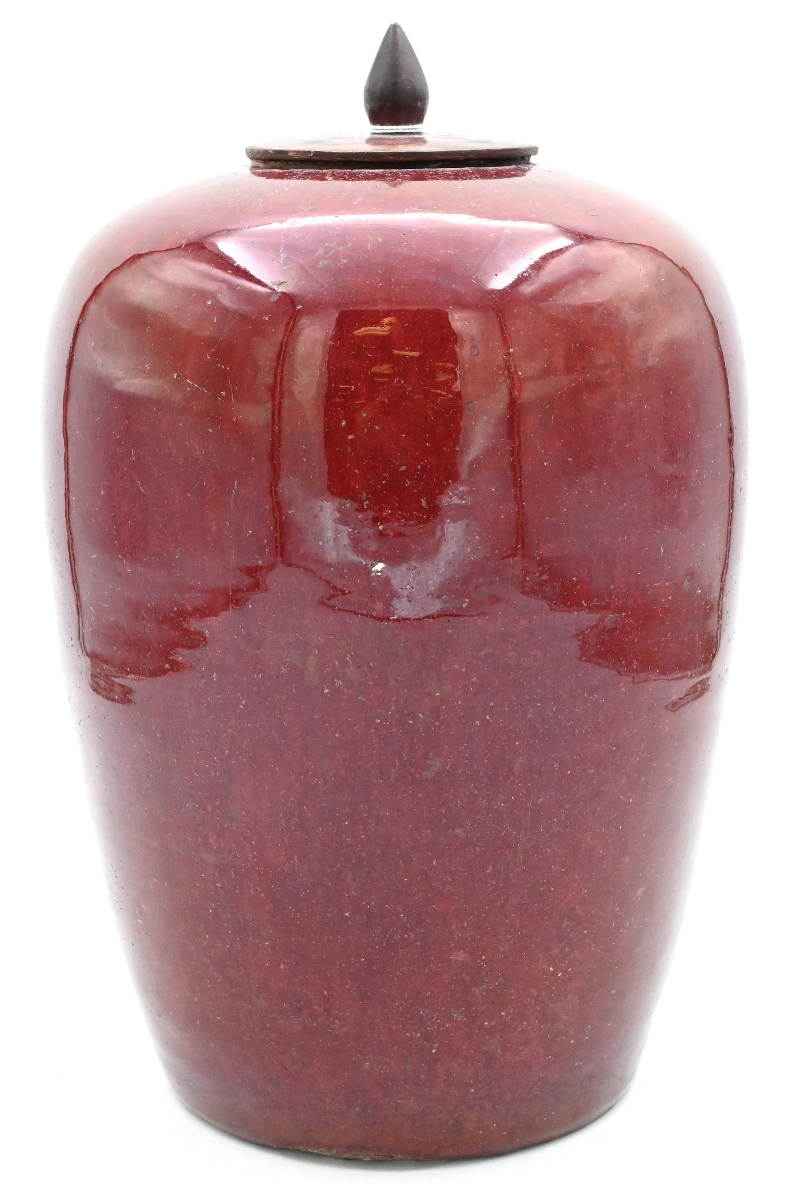 Chinese Sang de Boeuf Porcelain Ginger Jar: Chinese Sang de Boeuf Porcelain Ginger Jar oxblood red ground vase of tapering form having carved wood lid height 12 inches