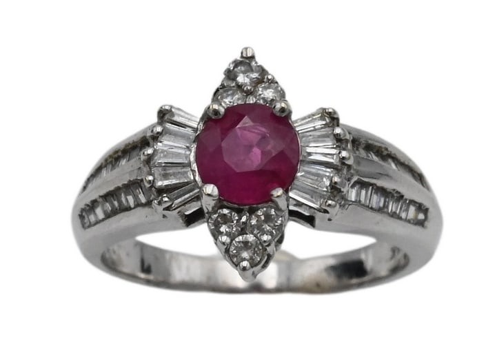 14K White Gold Ring: 14K White Gold Ring set with center round (possible) ruby surrounded by round and baguette diamonds size 7, weight 5.1 grams